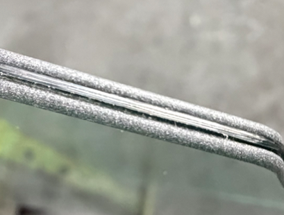 Laminated edge detail of heat-strengthened door glass